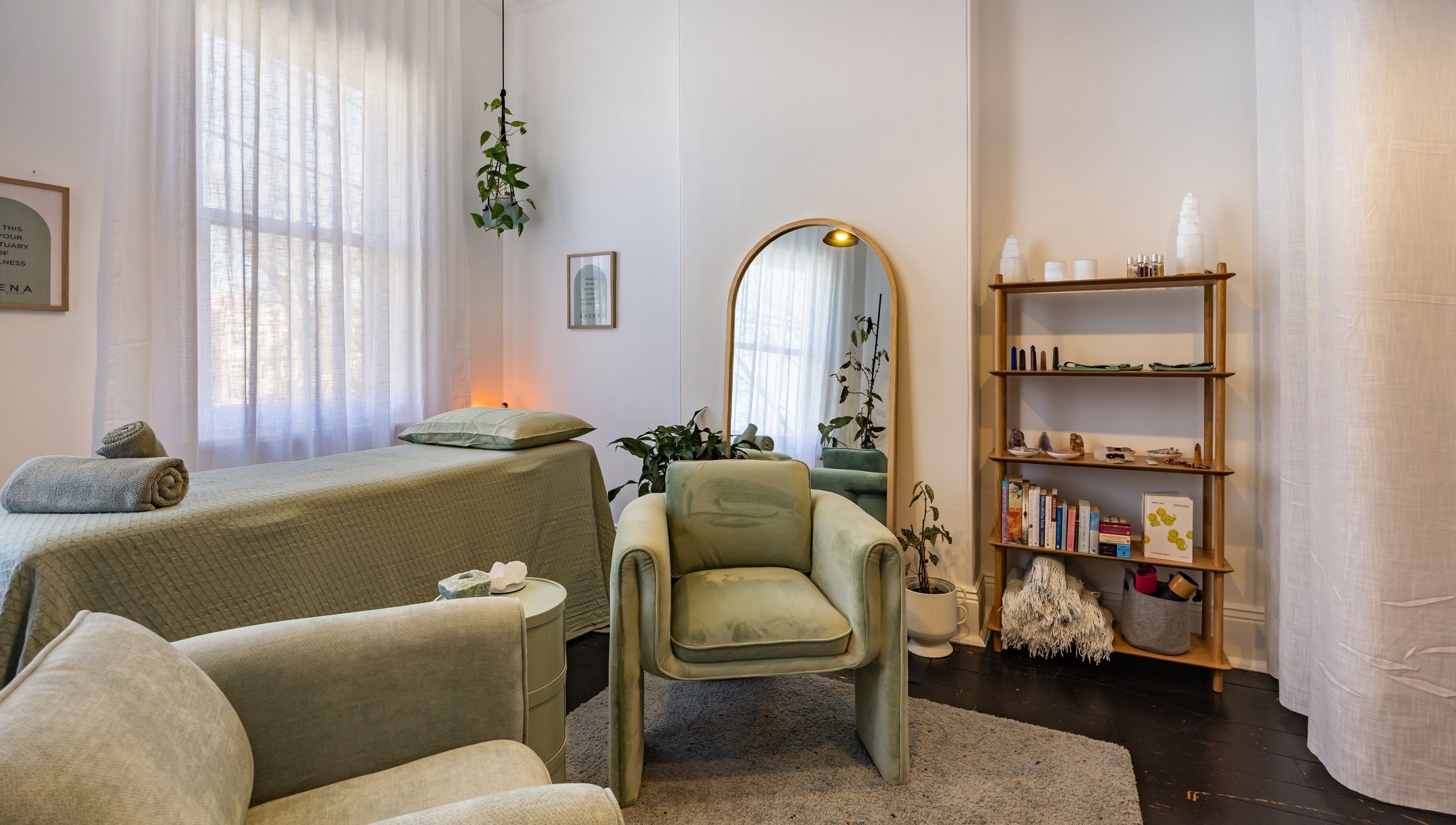 Cozy treatment room at SMENA Healing Studio in Melbourne, Victoria, AU with calming decor and natural light.