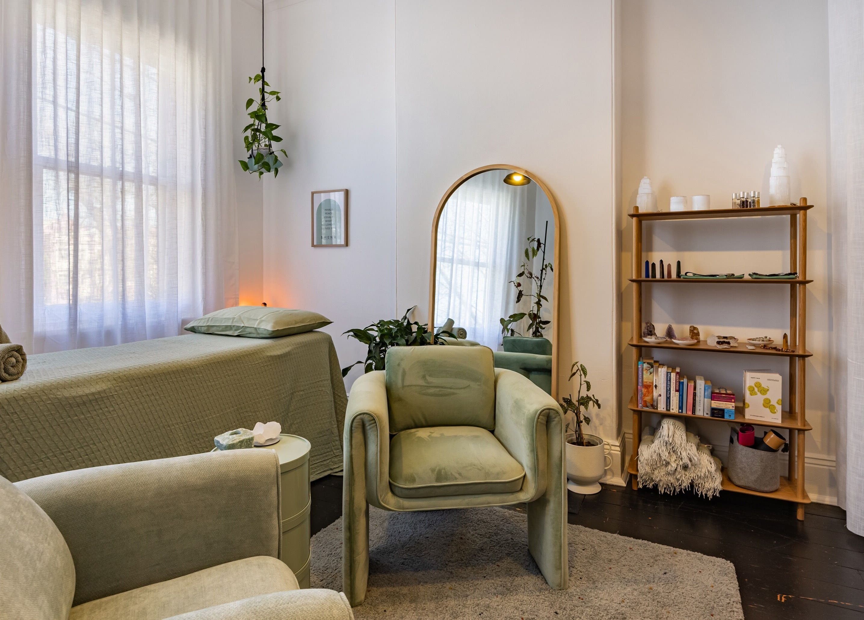 Cozy treatment room at SMENA Healing Studio in Melbourne, Victoria, AU with calming decor and natural light.