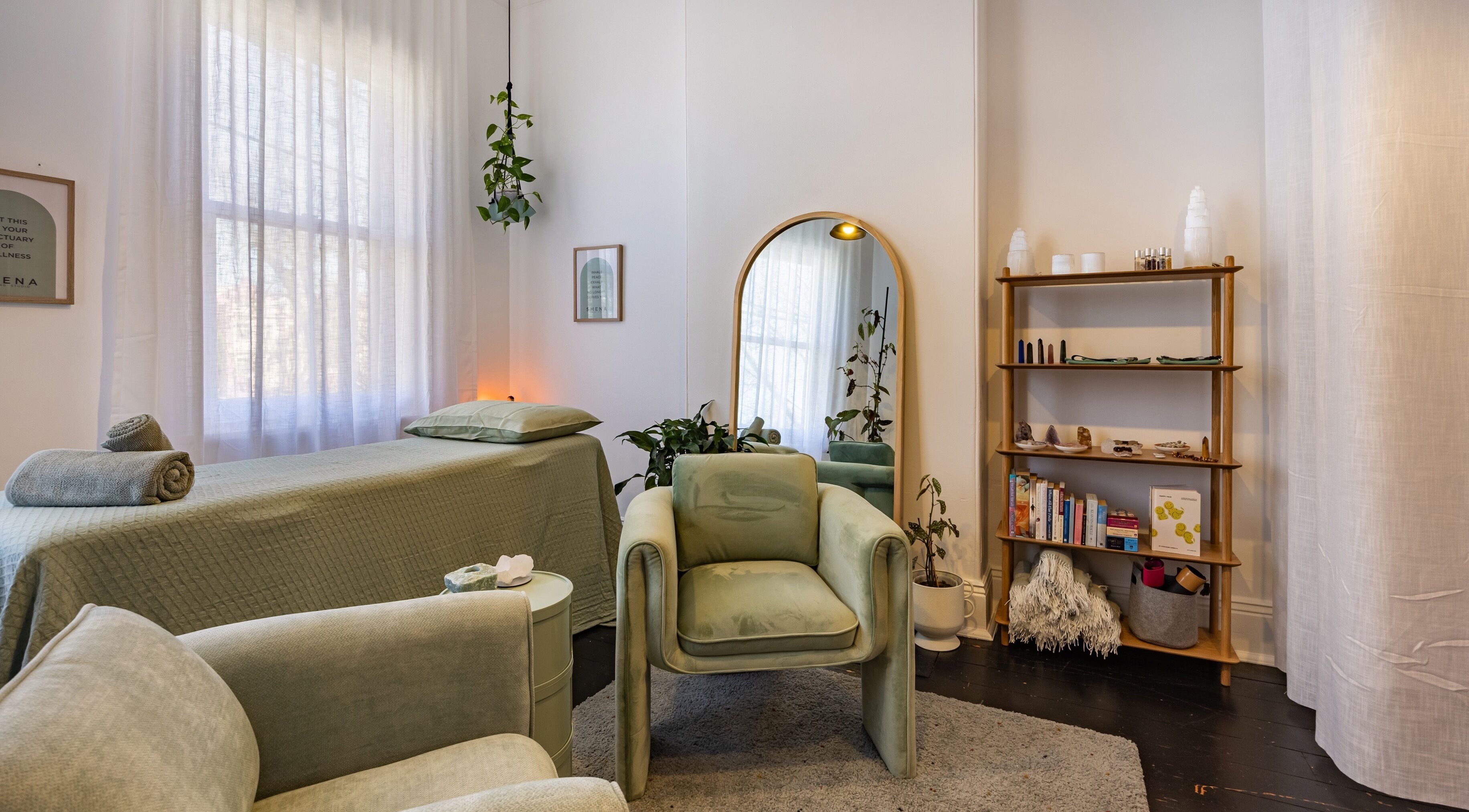 Cozy treatment room at SMENA Healing Studio in Melbourne, Victoria, AU with calming decor and natural light.