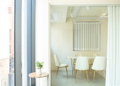 Bright meeting room at 비올 뷰티 BEALL BEAUTY, 서울특별시, Seoul, KR with white chairs and table.