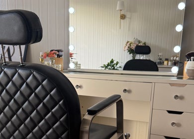 Elegant salon chair and lit vanity at JA Pro Beauty, Bundaberg West, Queensland, AU.