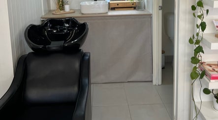 Elegant black salon chair and wash basin at JA Pro Beauty in Bundaberg West, Queensland, AU.