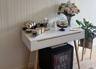 Elegant coffee corner at JA Pro Beauty, Bundaberg West, Queensland, AU with flowers and refreshments.