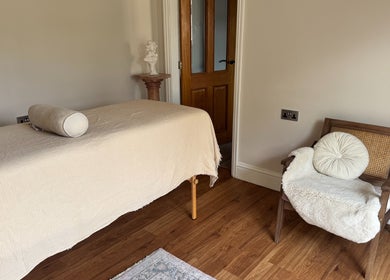 Calming massage room at The Soul Co, Walsall for women, featuring a serene ambiance and comfortable furnishings.