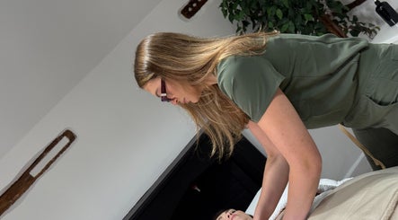 Massage therapist at The Soul Co at Curlita Beauty, Stafford, England, GB, performing a treatment.