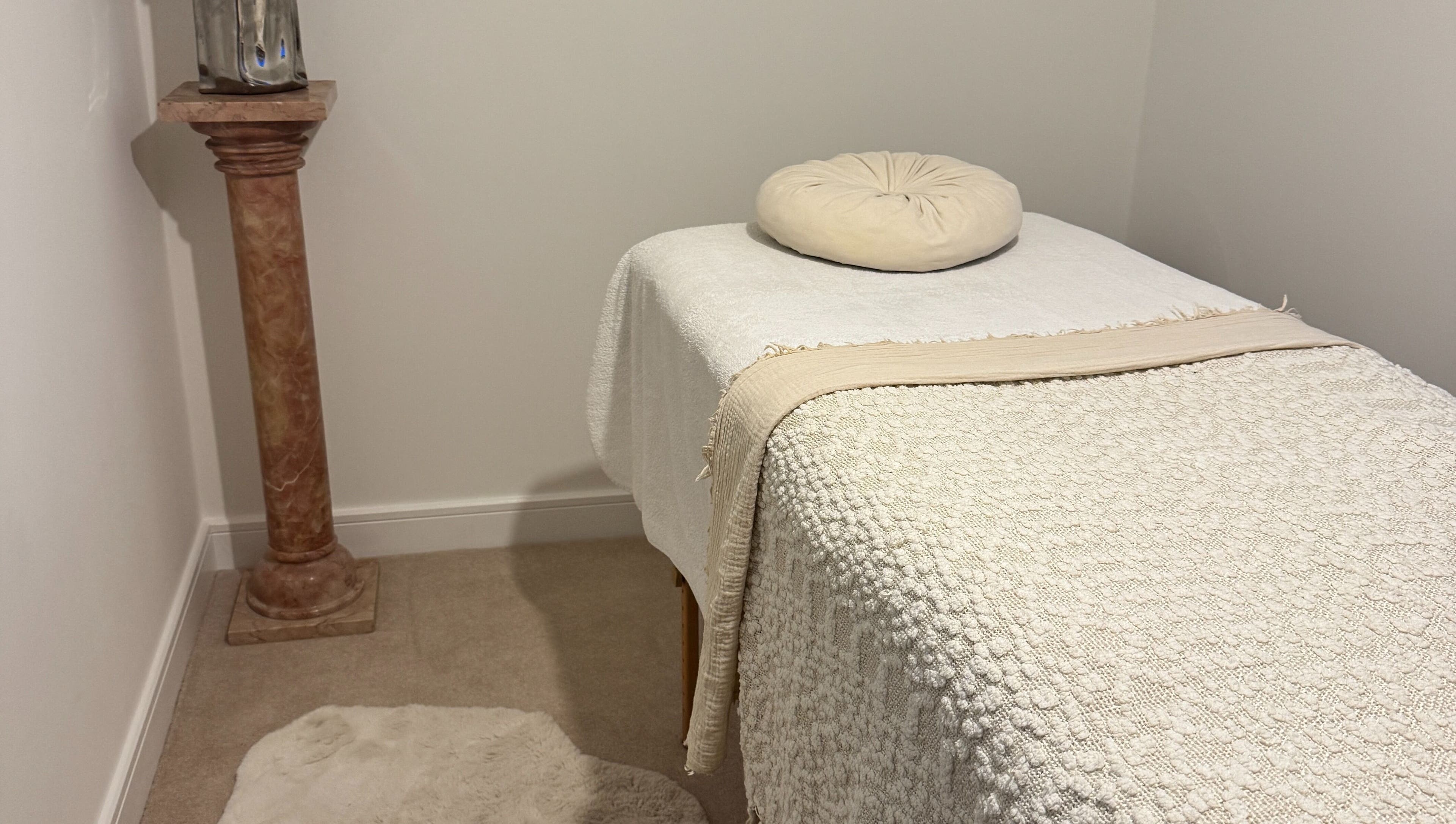 Relaxing massage room at The Soul Co - Warwickshire, Warwick, England, GB. Cozy setting with soothing tones.