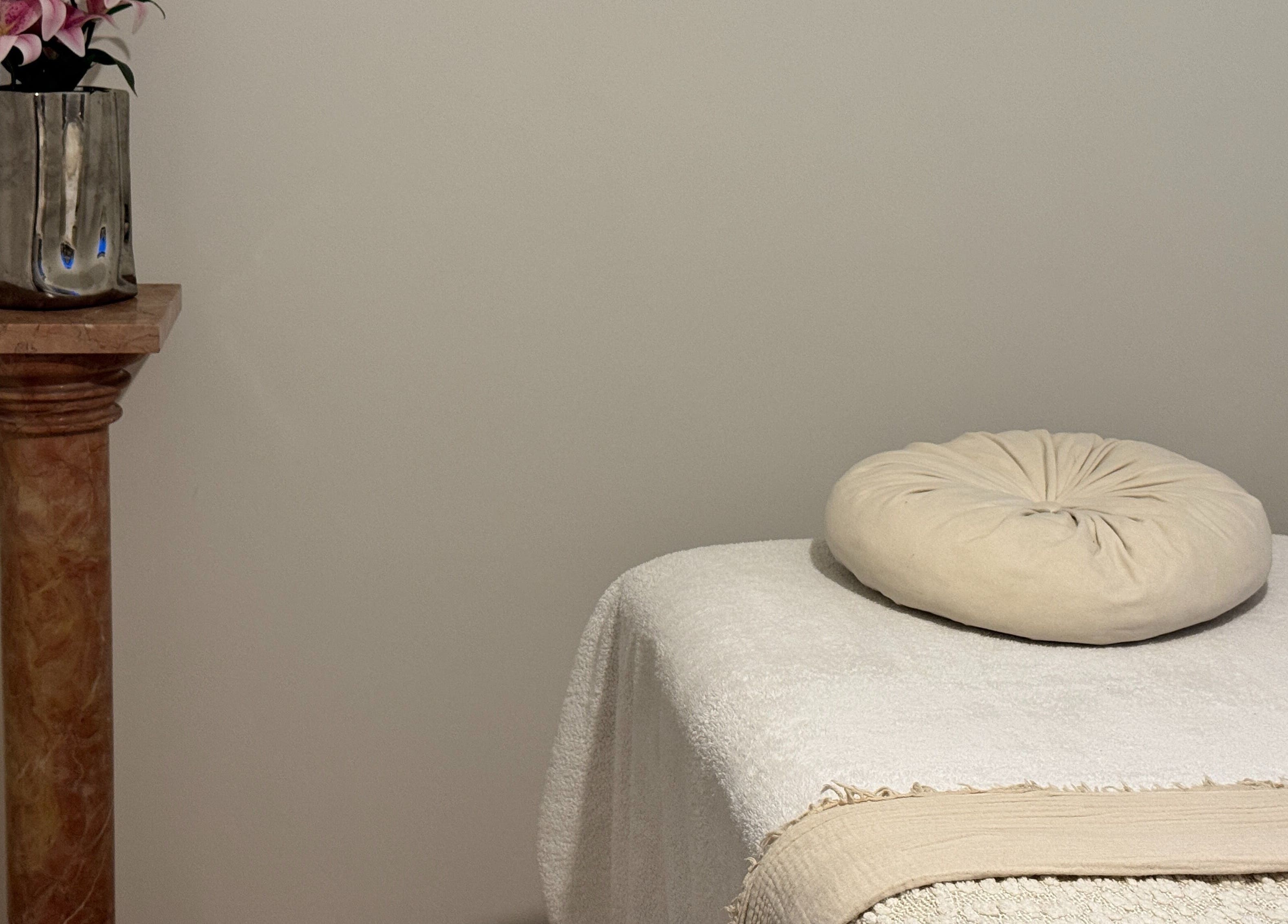 Relaxing massage table setup at The Soul Co - Warwickshire, Warwick, England, GB with soft linens.