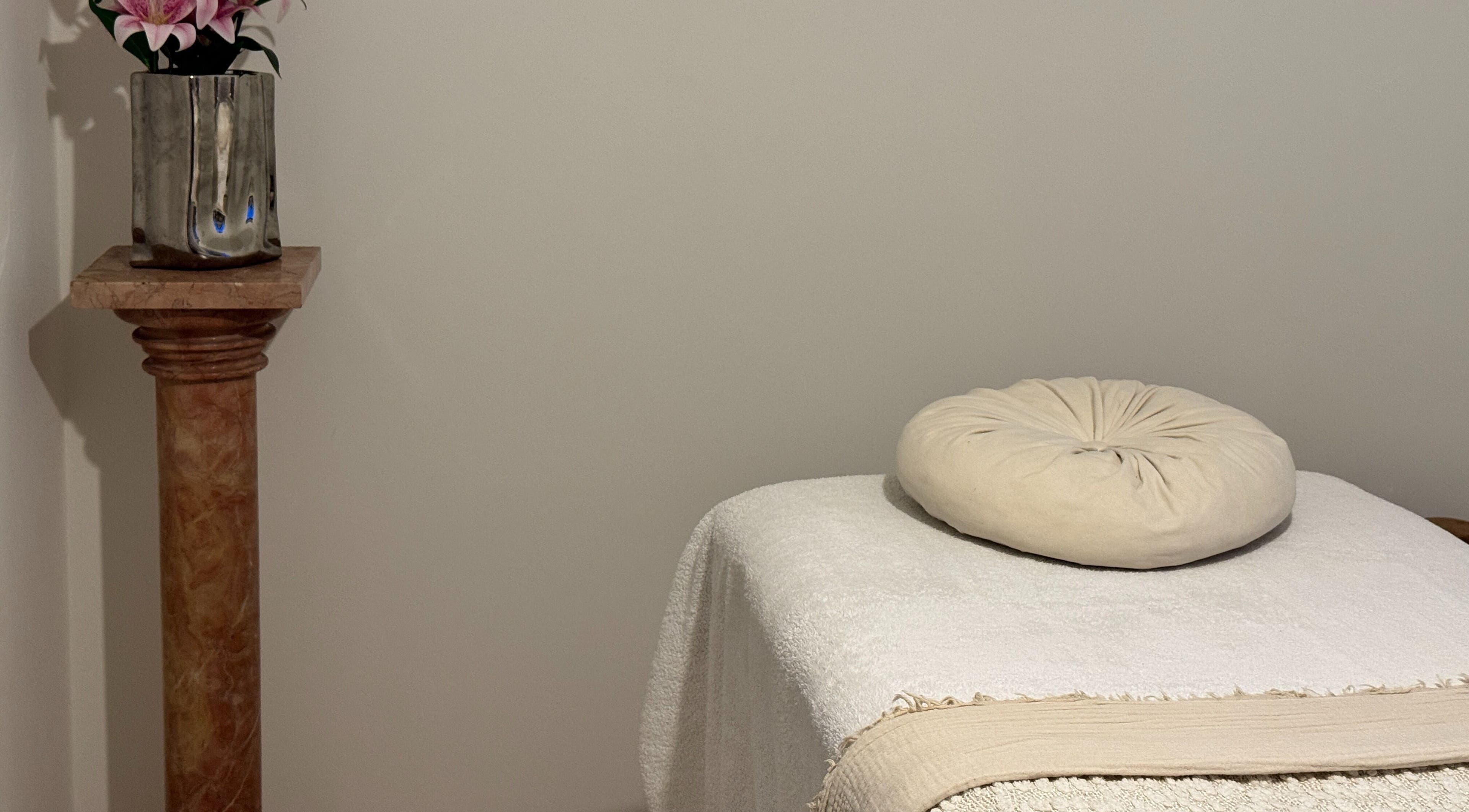 Relaxing massage table setup at The Soul Co - Warwickshire, Warwick, England, GB with soft linens.