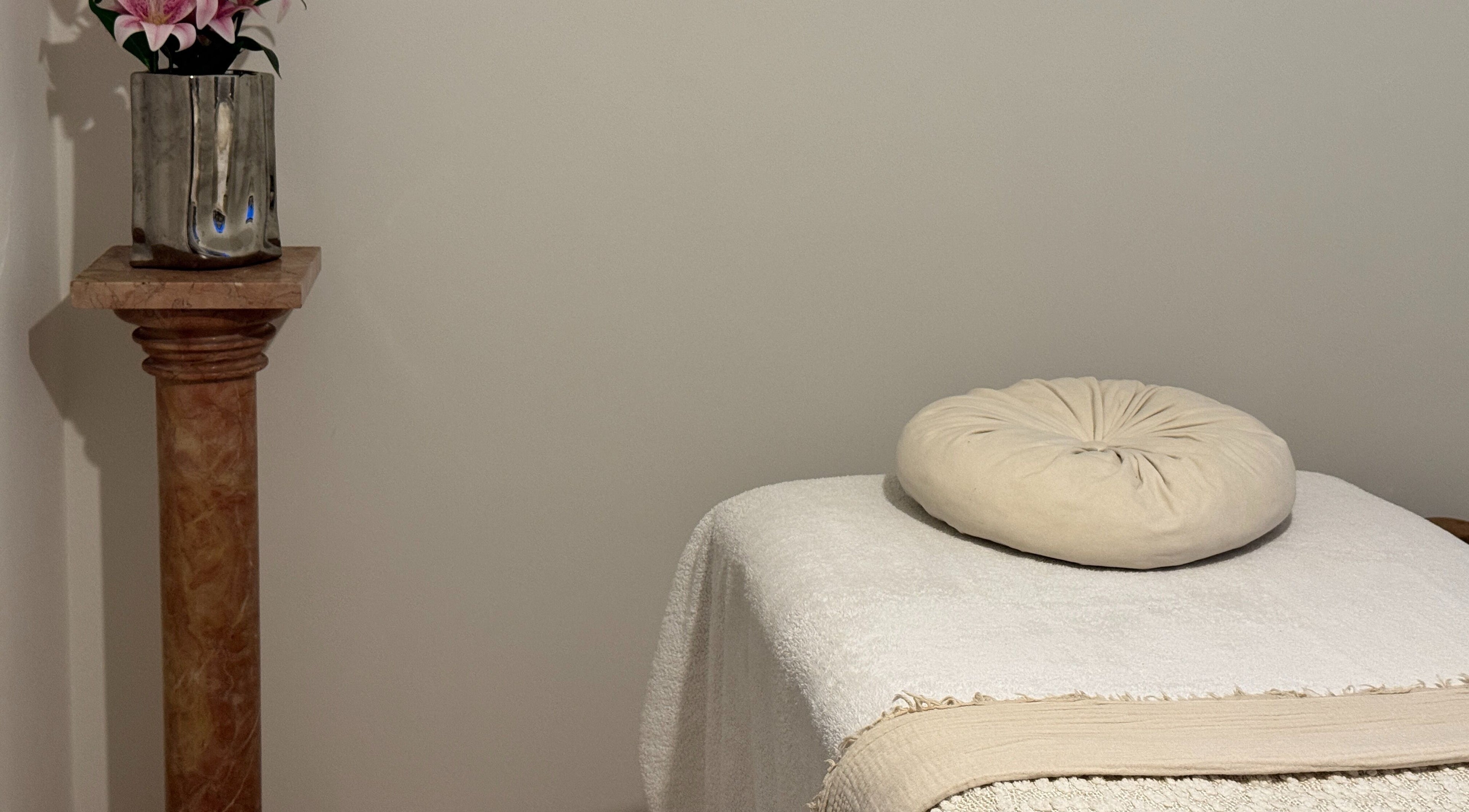 Relaxing massage table setup at The Soul Co - Warwickshire, Warwick, England, GB with soft linens.