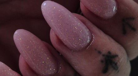 Sparkling manicure at Oliviabeautè, Eastbourne, England, GB showcases elegant, glittery nail design.