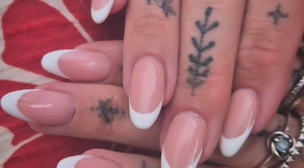 Elegant French manicure with tattoos at Oliviabeautè, Eastbourne, England, GB.