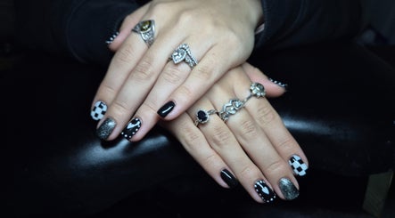 Stylish black and white nail art with rings at Oliviabeautè, Eastbourne, England, GB.