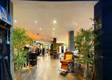 Elegant interior of Jo Gulliford Hairstylist in Brighton And Hove, GB, showcasing a stylish and vibrant salon atmosphere.