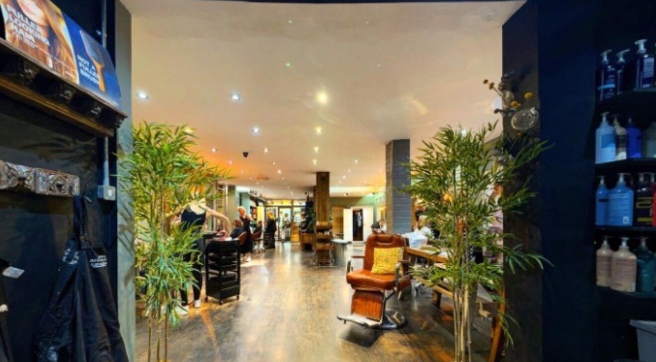 Elegant interior of Jo Gulliford Hairstylist in Brighton And Hove, GB, showcasing a stylish and vibrant salon atmosphere.