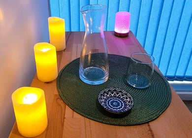 Peaceful candlelit setup at Duo Soul Flow, Reading, England, GB, with a glass jug and decorative bowl.