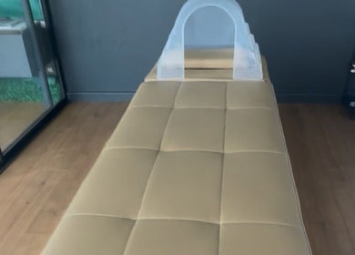 Tranquil massage room at The Peace Lab, Cape Town, Western Cape, ZA, featuring comfortable massage table.