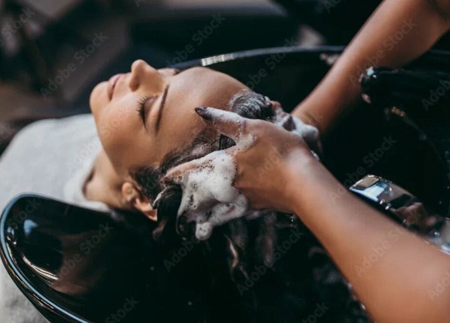 Relaxing hair wash at Virtuosity, Al Hidd, Muḥāfaẓat Al-muḥarraq, BH, showcasing premium salon care.