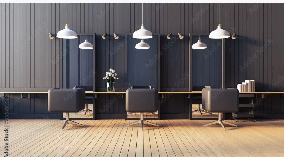 Elegant salon setup at Virtuosity, Al Hidd, Muḥāfaẓat Al-muḥarraq, BH featuring sleek chairs and modern lighting.