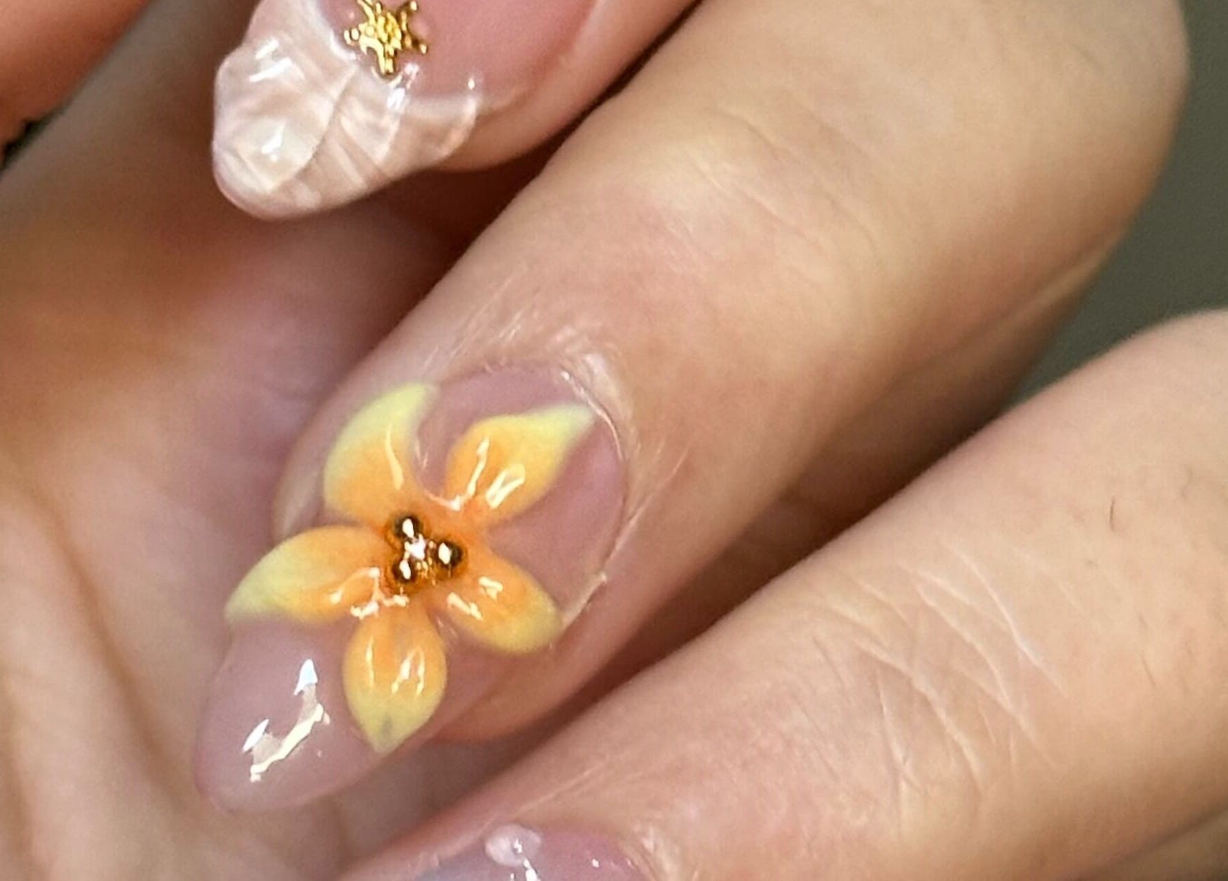 Close-up of intricate flower nail art at The Juju Studio, Bankstown, New South Wales, AU.
