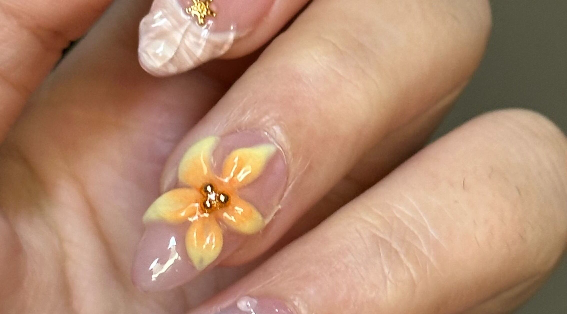 Close-up of intricate flower nail art at The Juju Studio, Bankstown, New South Wales, AU.