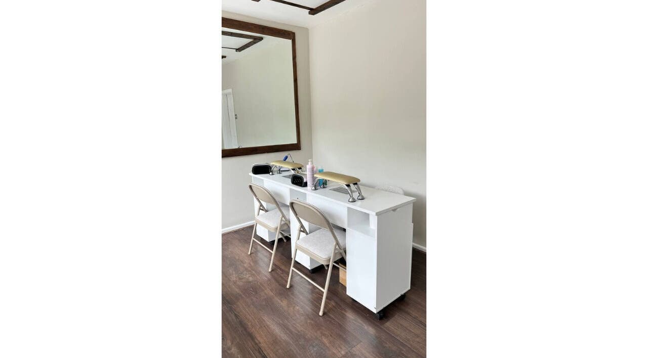 Stylish interior of Irlam Nail Studio in Irlam, England, GB with sleek nail stations and elegant decor.