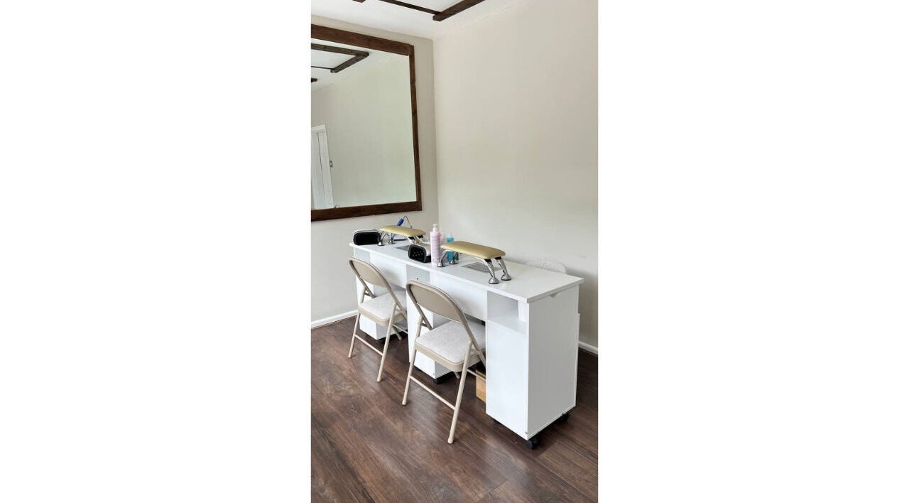 Stylish interior of Irlam Nail Studio in Irlam, England, GB with sleek nail stations and elegant decor.