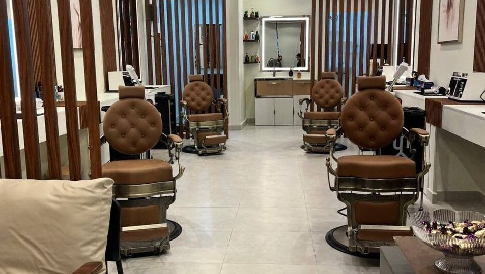 Astur Barbershop, Riyadh Province, SA, featuring luxurious brown leather chairs.