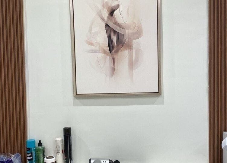 Modern artwork above grooming tools at صالون أسطر للحلاقة - Astur Barbershop, Riyadh, Riyadh Province, SA.