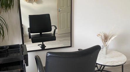 Stylish salon chair and mirror at Blended Hair & Wellness, Hounslow, England, GB.