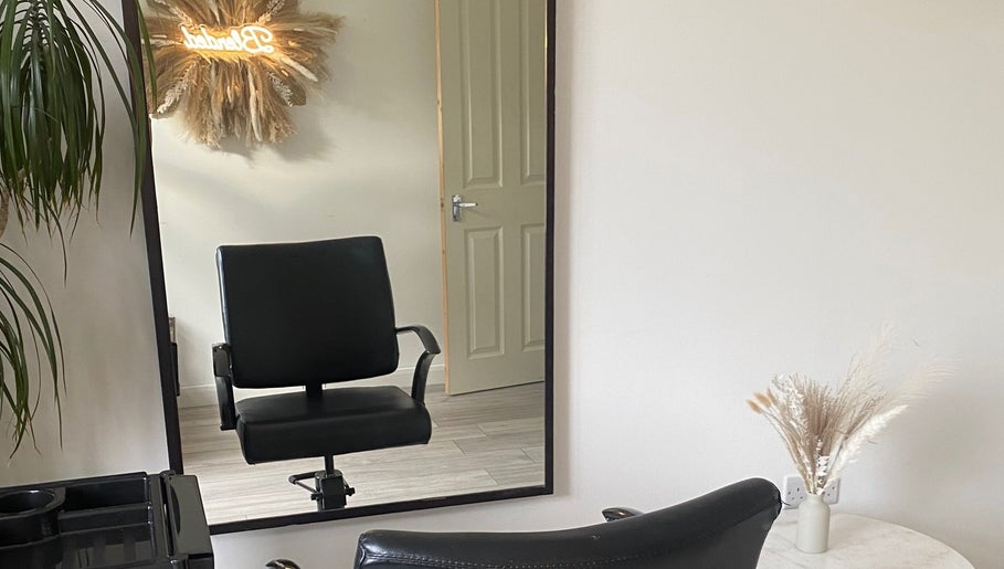 Chic salon chair at Blended Hair & Wellness, Hounslow, England, GB, showcasing a modern and inviting setup.