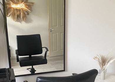 Chic salon chair at Blended Hair & Wellness, Hounslow, England, GB, showcasing a modern and inviting setup.