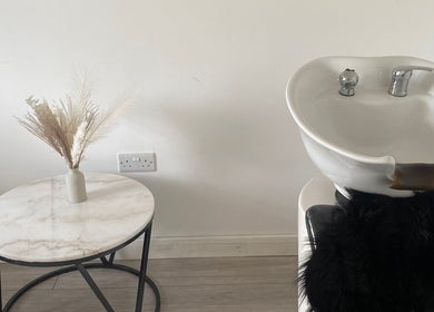 Hair wash station at Blended Hair & Wellness, Hounslow, England, GB, with elegant decor accents.