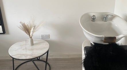 Hair wash station at Blended Hair & Wellness, Hounslow, England, GB, with elegant decor accents.