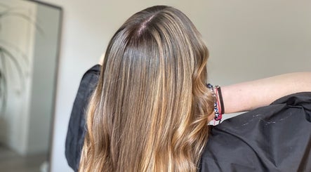 Shiny, highlighted hair at Blended Hair & Wellness, Hounslow, England, GB, showcasing professional styling.