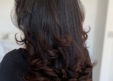 Luxurious wavy hair styled at Blended Hair & Wellness, Hounslow, England, GB for a stunning look.