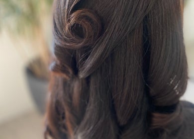 Elegant curled hairstyle at Blended Hair & Wellness in Hounslow, England, GB.