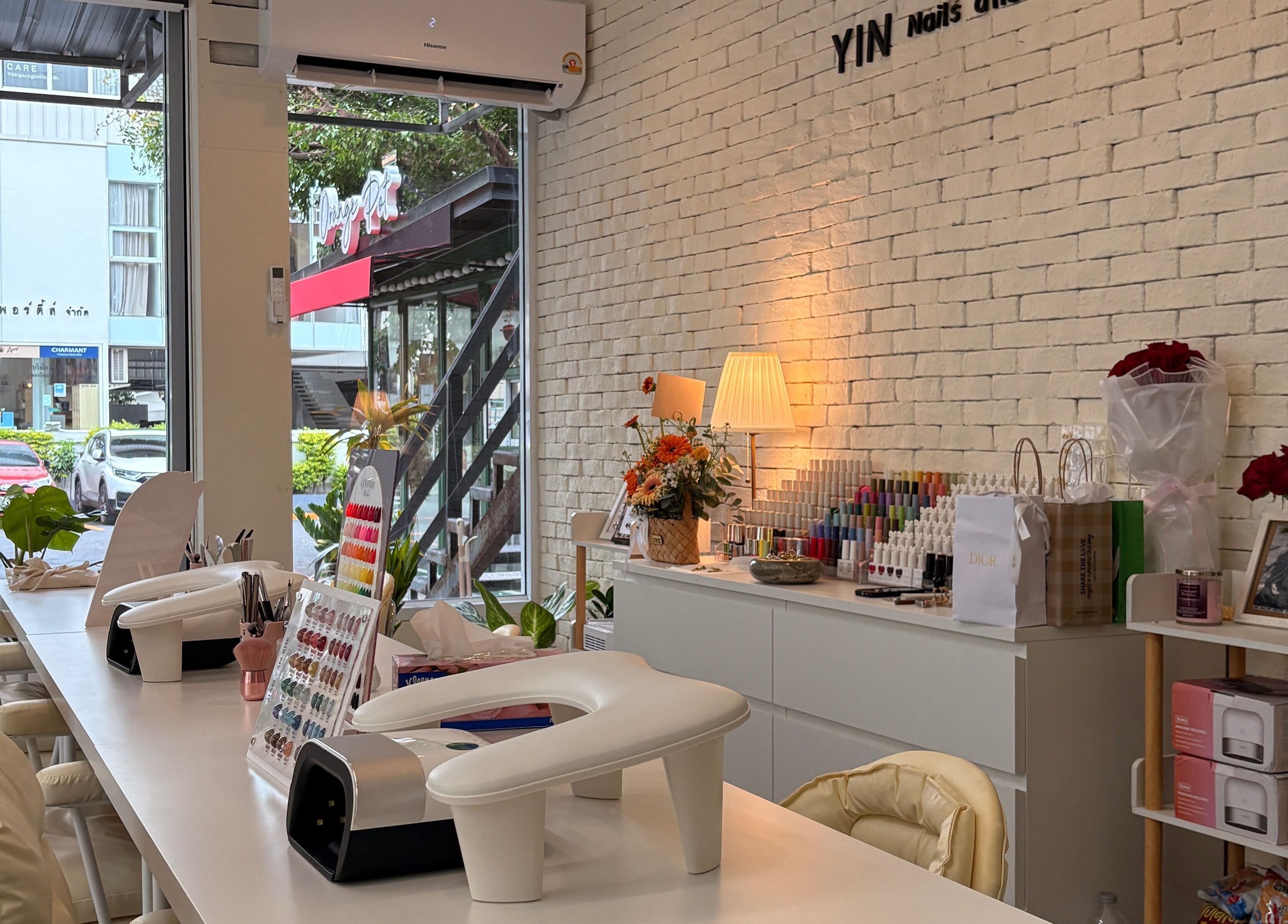 Inviting interior of YIN Nails and Lashes in Krung Thep Maha Nakhon with cozy seating and nail essentials.