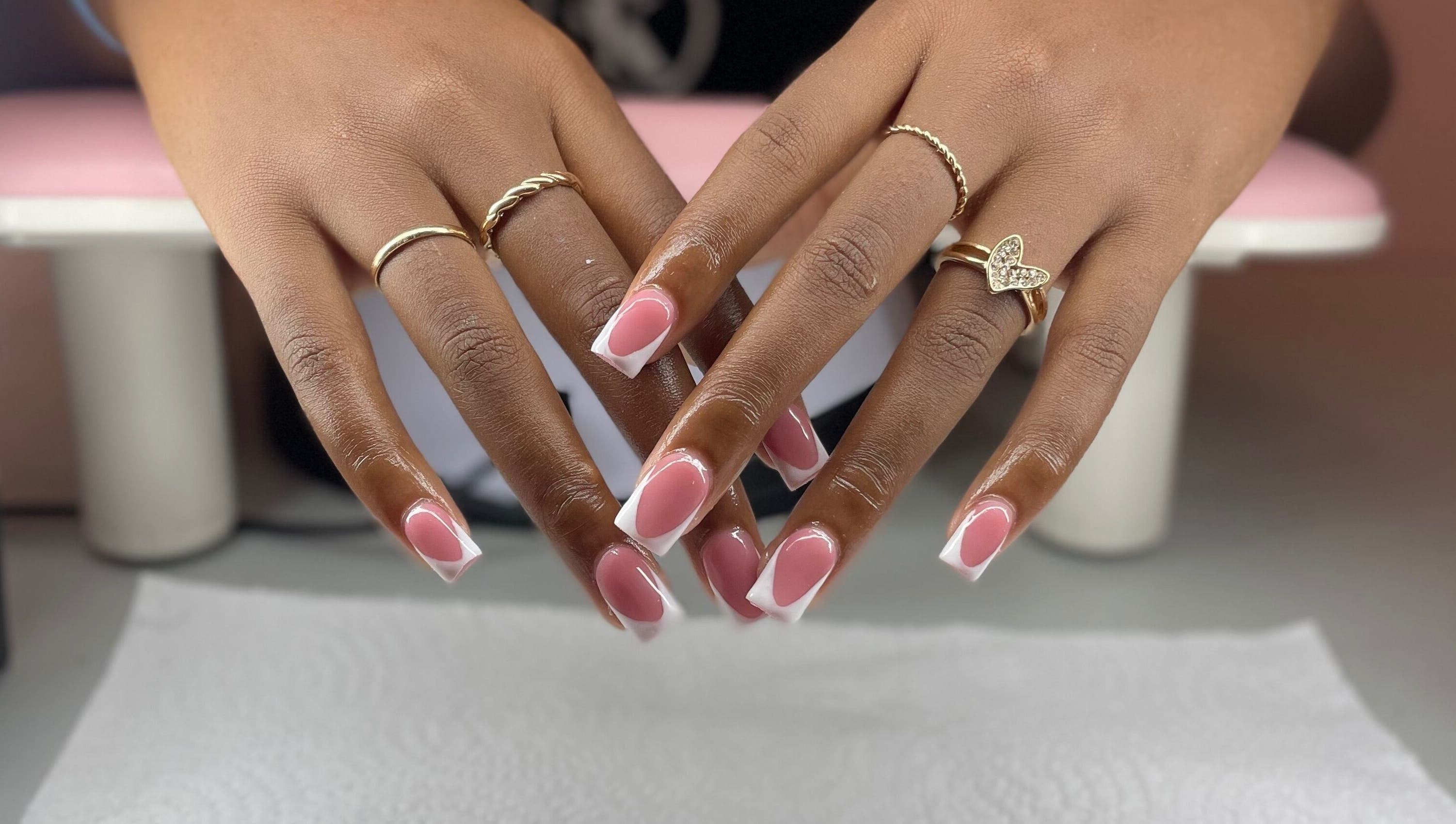 Pretty in Polygel offers elegant pink-and-white manicures in Portsmouth, Saint John Parish, DM.