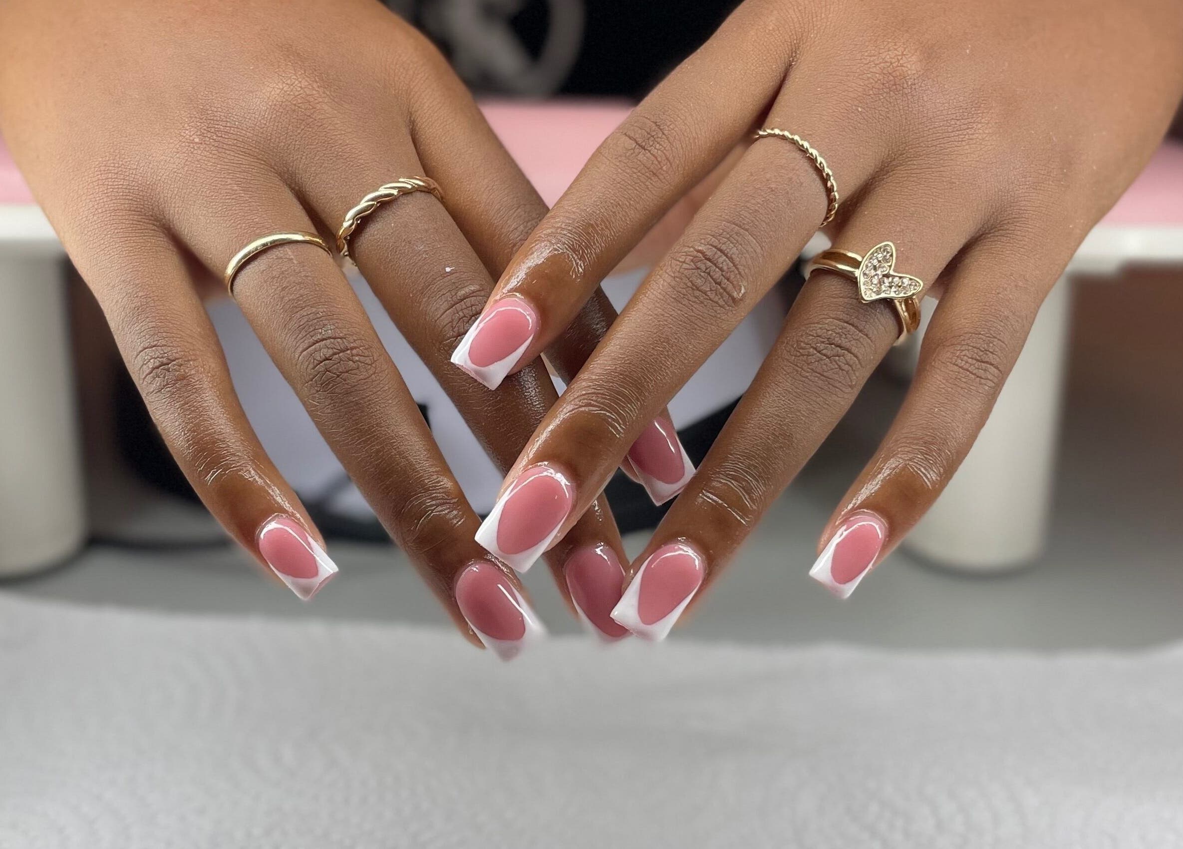 Pretty in Polygel offers elegant pink-and-white manicures in Portsmouth, Saint John Parish, DM.