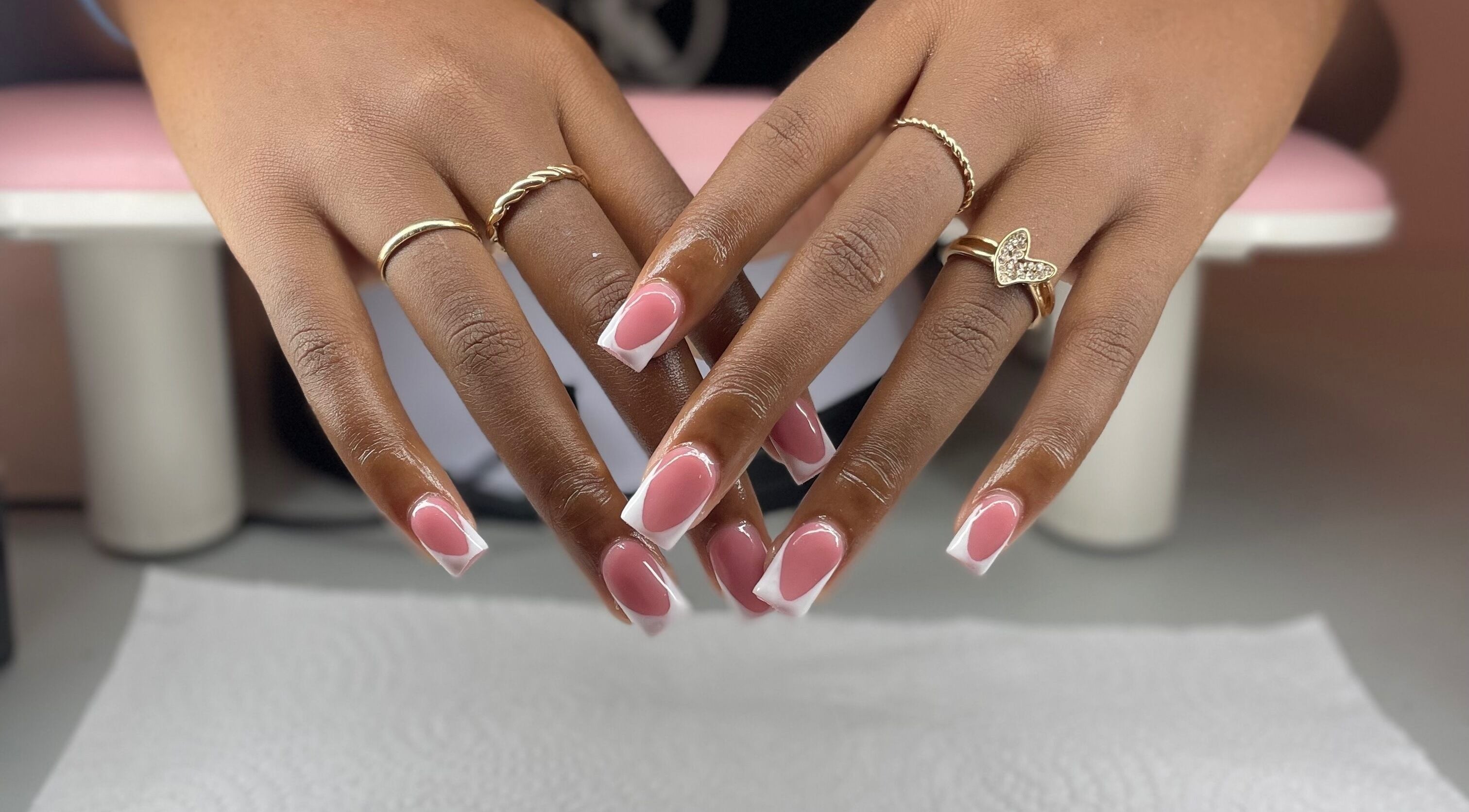 Pretty in Polygel offers elegant pink-and-white manicures in Portsmouth, Saint John Parish, DM.