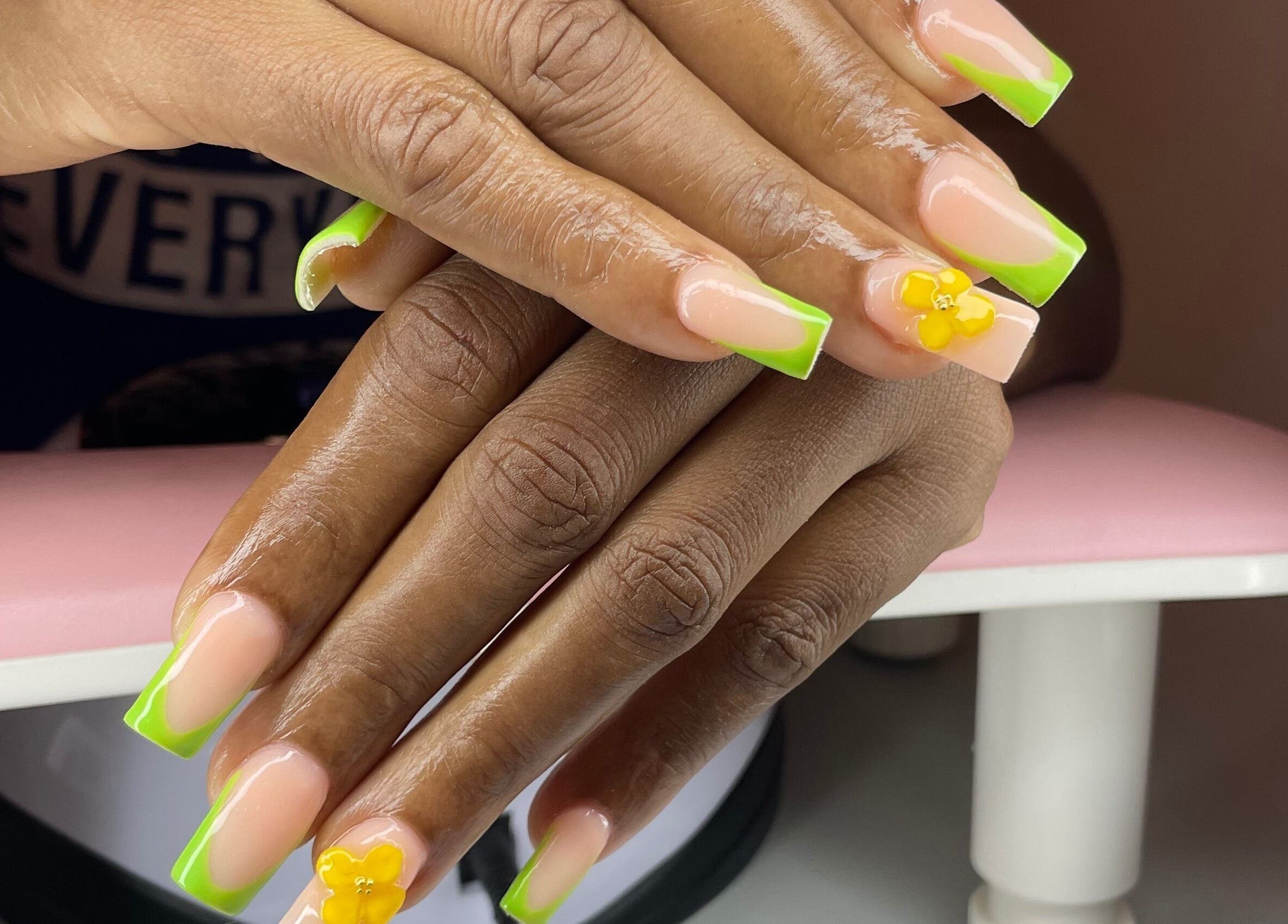 Bright neon green and floral nail art from Pretty in Polygel in Portsmouth, Saint John Parish, DM.