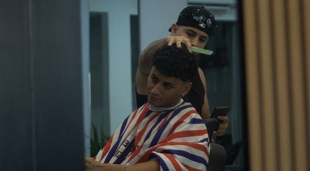 Barber styling a client's hair at Alberto's Barber and Wellness Hub, Gzira, MT.