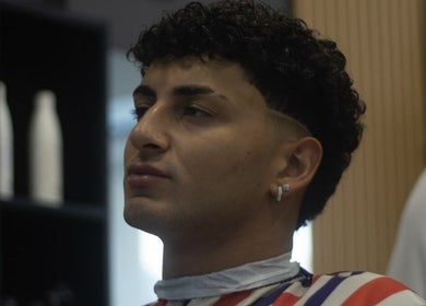 Stylish haircut at Alberto's Barber and Wellness Hub in Gzira, MT, showcasing modern grooming techniques.
