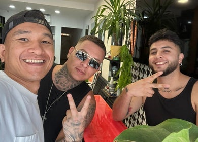 Happy patrons at Alberto's Barber and Wellness Hub in Gzira, MT enjoying stylish haircuts.