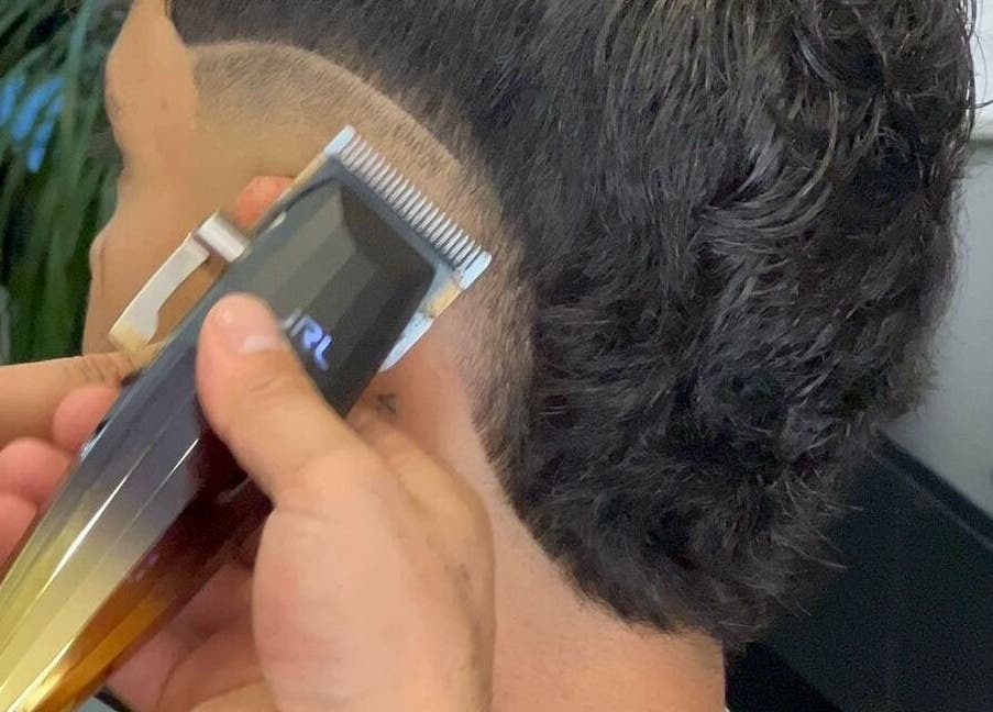 Professional haircut in progress at Alberto's, Gzira, MT, highlighting expert grooming techniques.