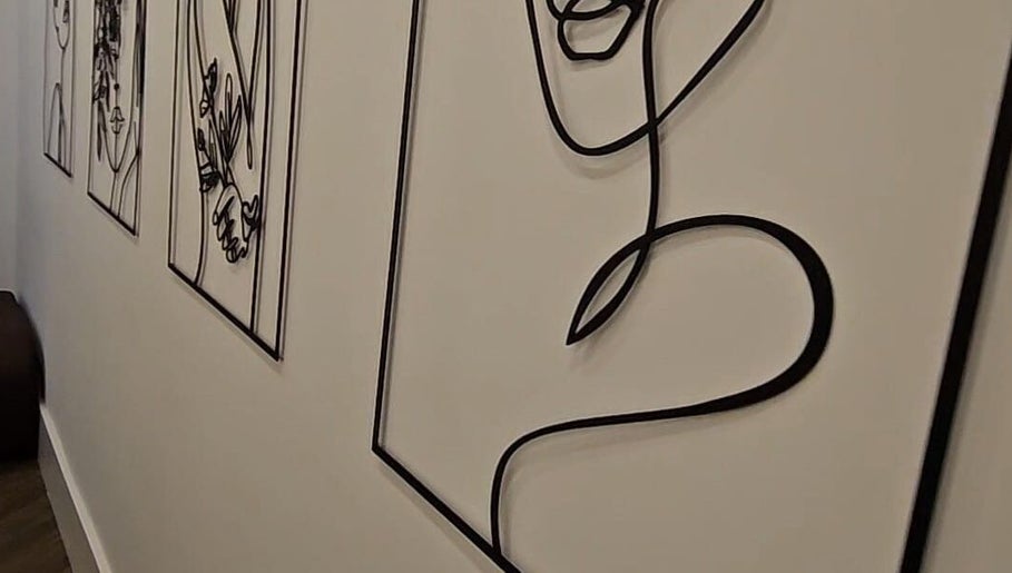 Modern line art at Mae Medical Aesthetics, London, England, GB enhances a serene and elegant atmosphere.