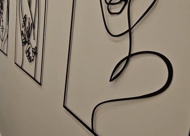 Intricate line art decorates the walls of Mae Medical Aesthetics in London, England, GB, creating a serene ambiance.