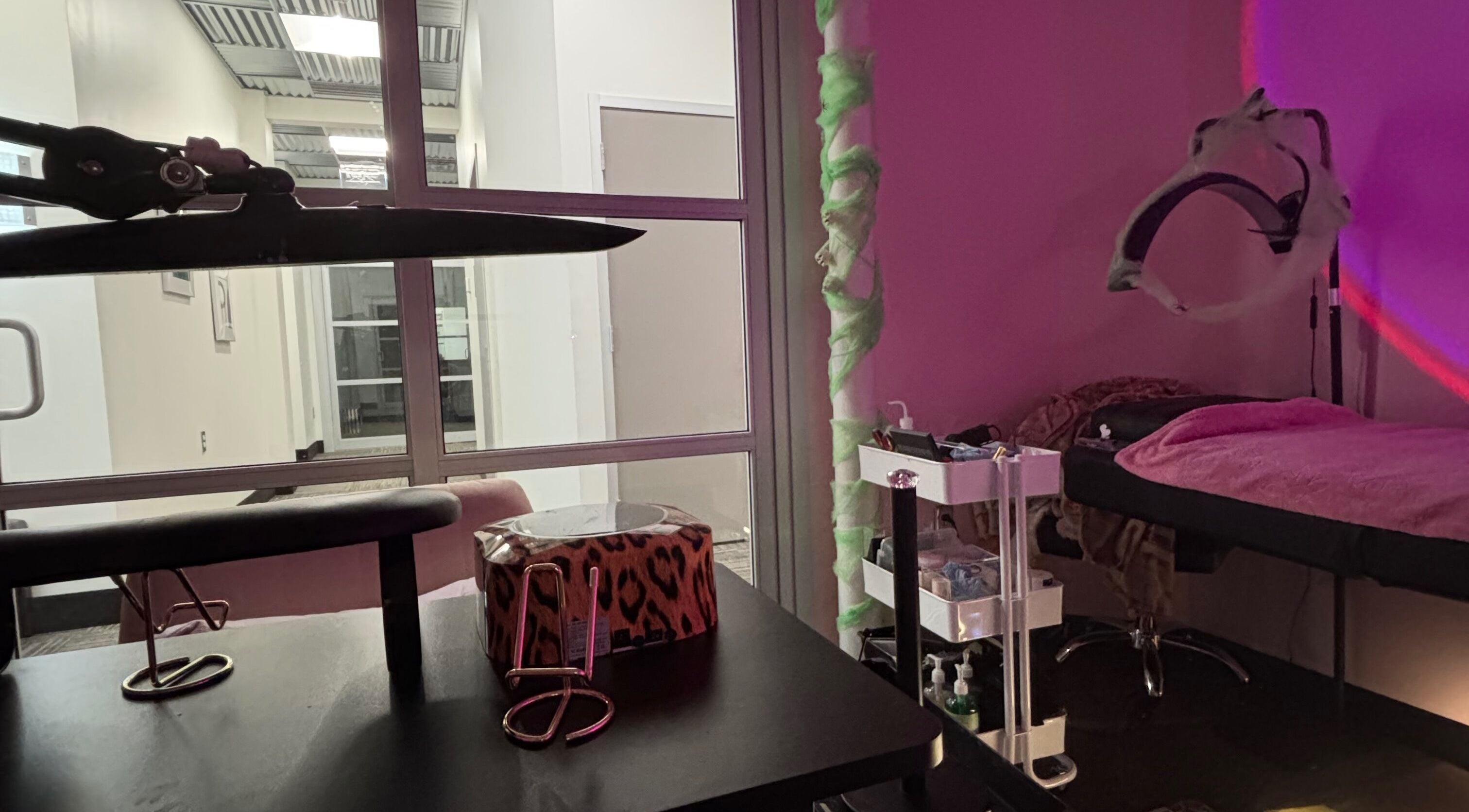 Relaxing treatment room at beautyxpaloma in Vero Beach, Florida, US with table and equipment.