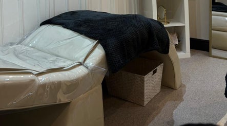 Cozy treatment room at Rebel Beauty in Burnley, England, GB, featuring a plush bed and calming decor.