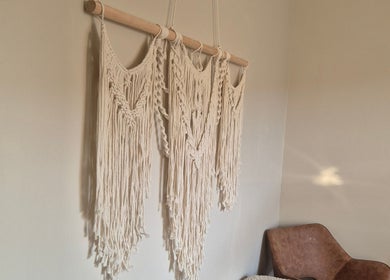 Elegant macrame wall art at Wild Aura Denny, Denny, Scotland, GB, adding a calming touch to the wellness space.